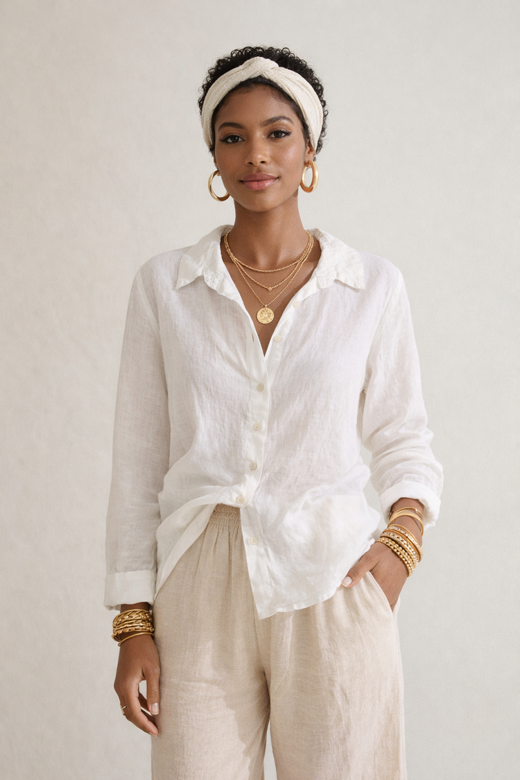 woman wearing white blouse and linen pants from Cut Loose clothing brand