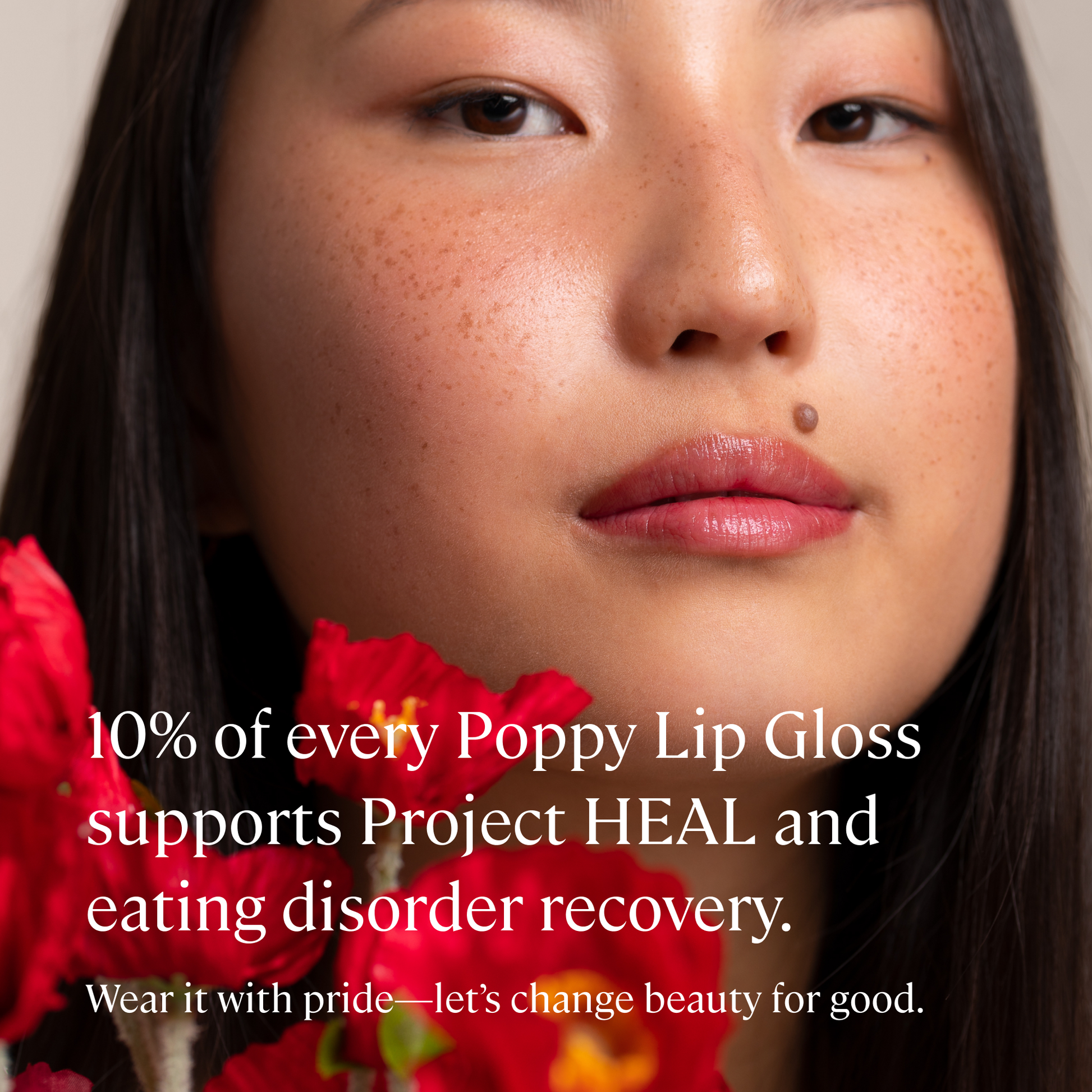 Poppy Red Hydrating Lip Gloss by Minori Beauty - Text reads 10% of everry poppy lip gloss supports project HEAL and eating disorder recovery.