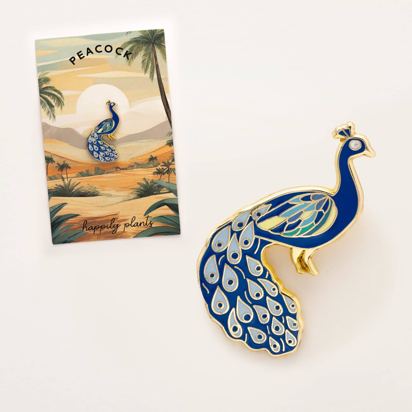 Happily Plants blue and gold peacock enamel pin
