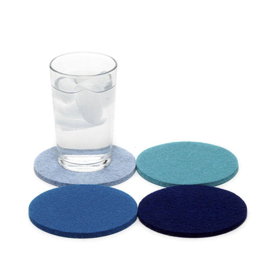 Set of four blue round Graf Lantz coasters in merino wool