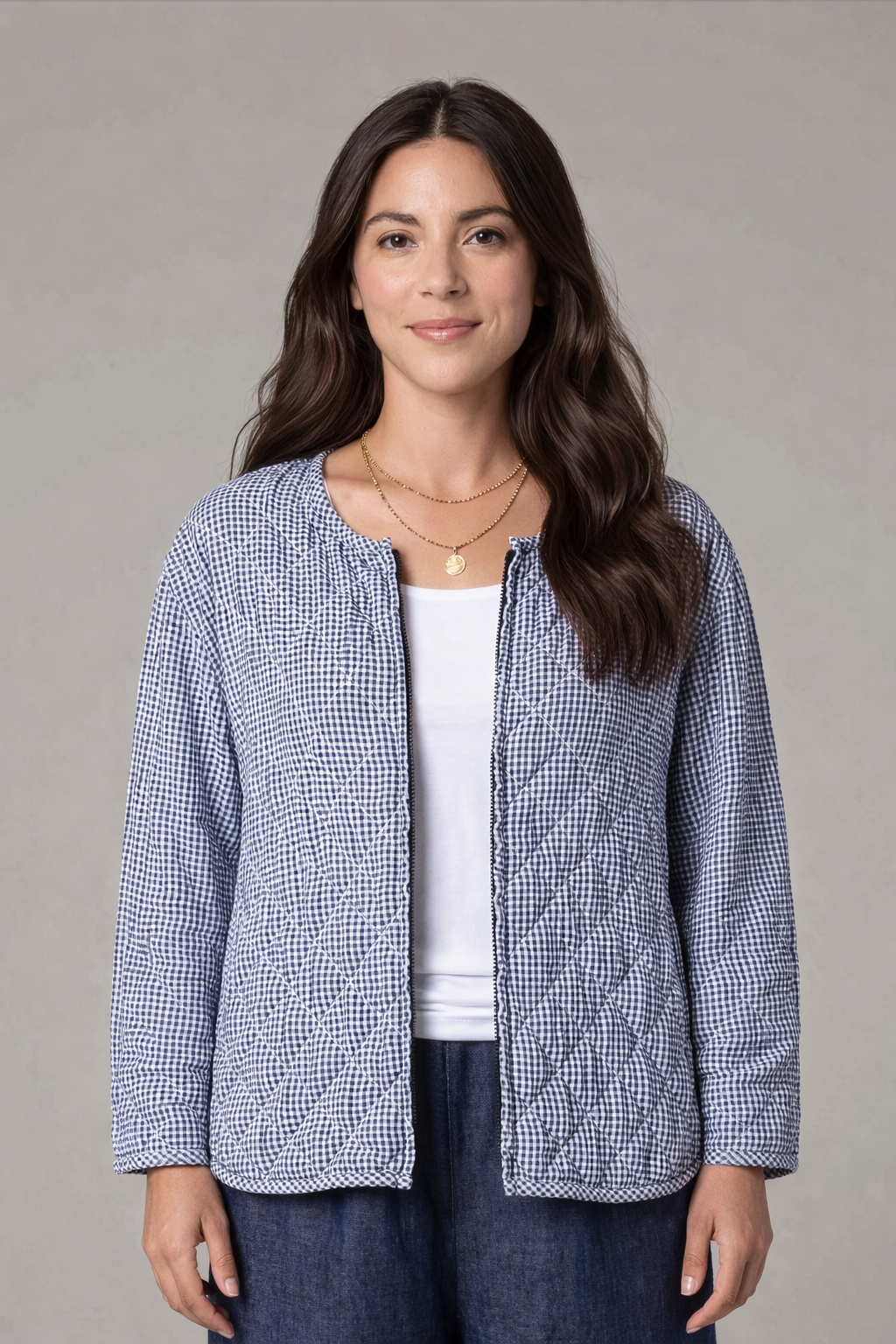 Woman wearing Cut Loose Clothing navy gingham quilted jacket