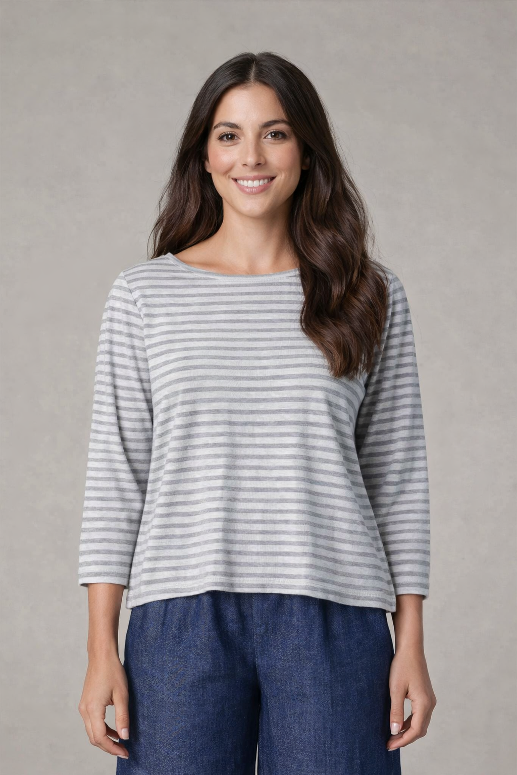 Model wearing boatneck top for women with gray stripes