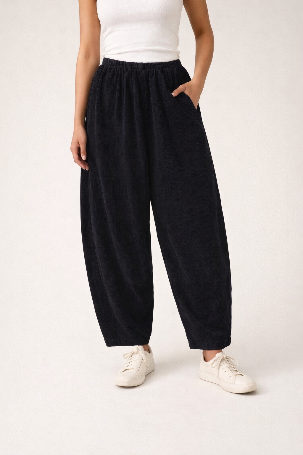 Woman wearing Cut Loose Clothing black barrel corduroy pants