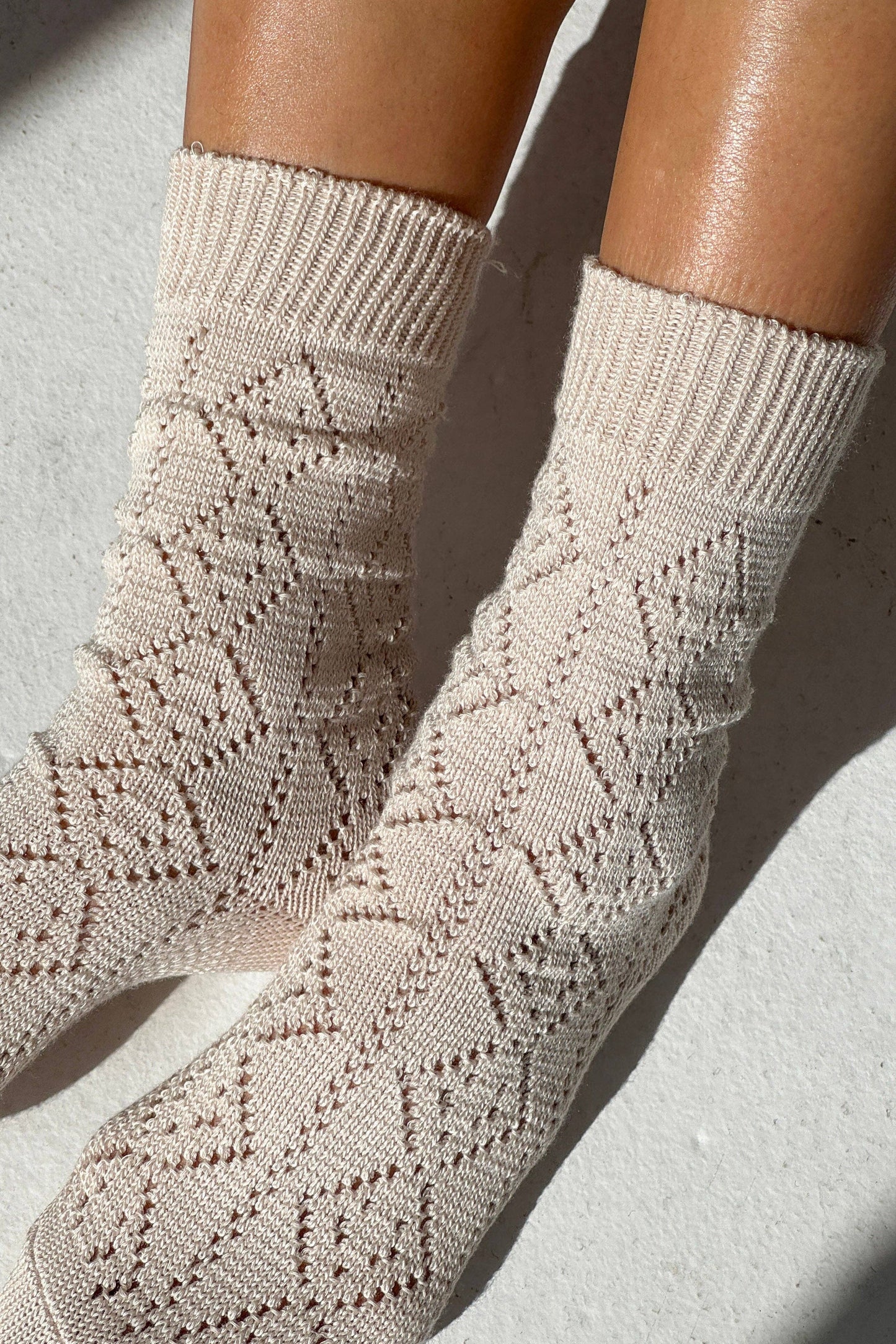 Woman wearing Le Bon Shoppe socks - ivory with pointelle knit
