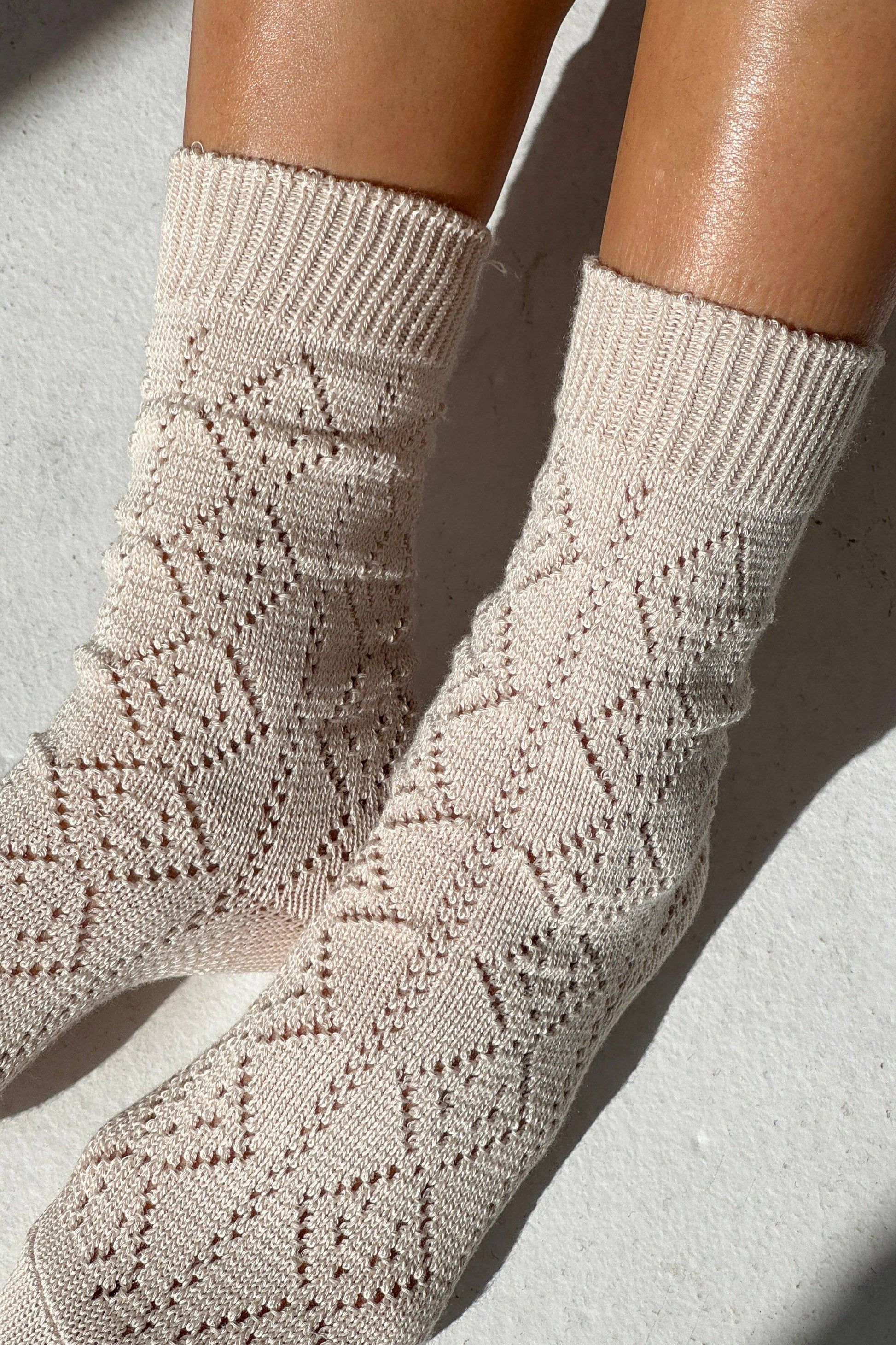 Woman wearing Le Bon Shoppe socks - ivory with pointelle knit
