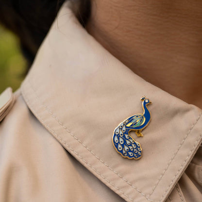 Happily Plants blue and gold peacock enamel pin