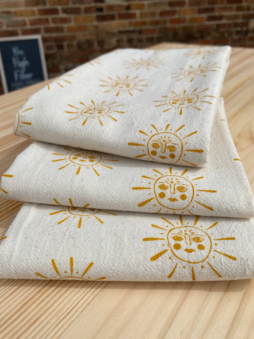 Suns Tea Towel